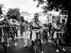 Wellington Batucada drummers and dancers parade at CubaDupa. Photo by Bokeh Street.