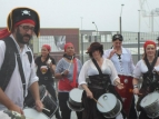 2014 Sevens waterfront parade day 2 - drumming in the driving rain - photo by Alan Shuker