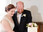 Phill & Bron's wedding - cutting the cake - photo by Paul Howell Photography