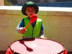 2015 Sevens Parade - small person, big drum - photo by Alan Shuker