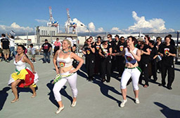 Batucada dancers lead the band onto the Stadium walkway