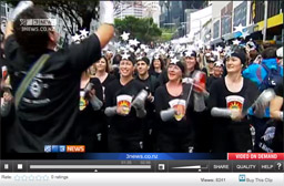 Screenshot of Wellington Batucada in the All Blacks Rugby World Cup 2011 victory parade - TV3