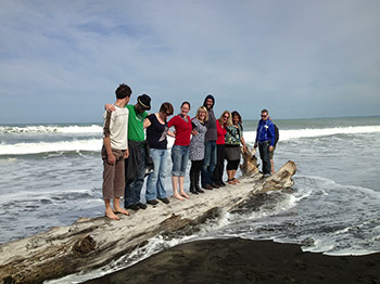 (Some of) the band on a log as the tide comes in - photo by AliG